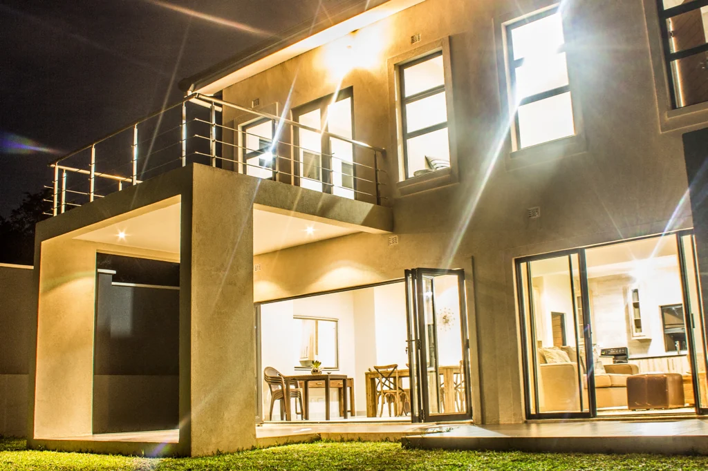 Completed Synergy residence illuminated at night